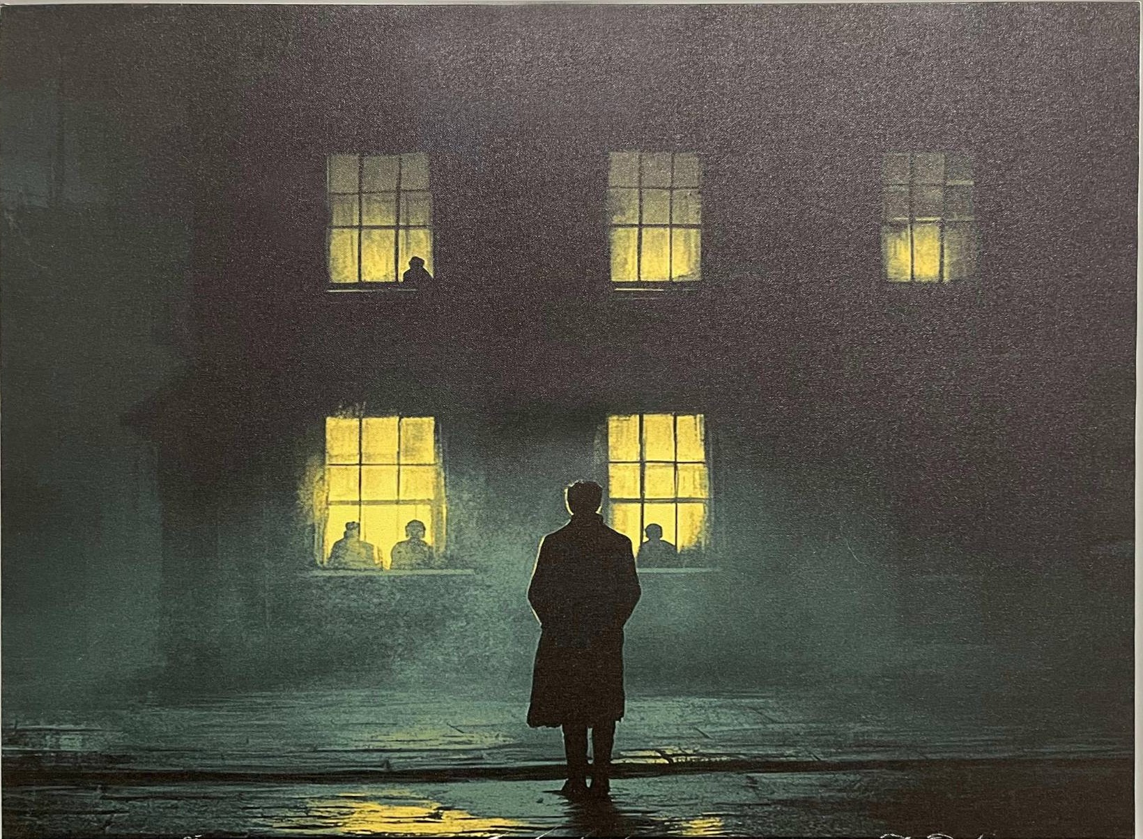 A lone figure in a long coat on a wet street at night, facing a building with glowing windows and silhouettes within.